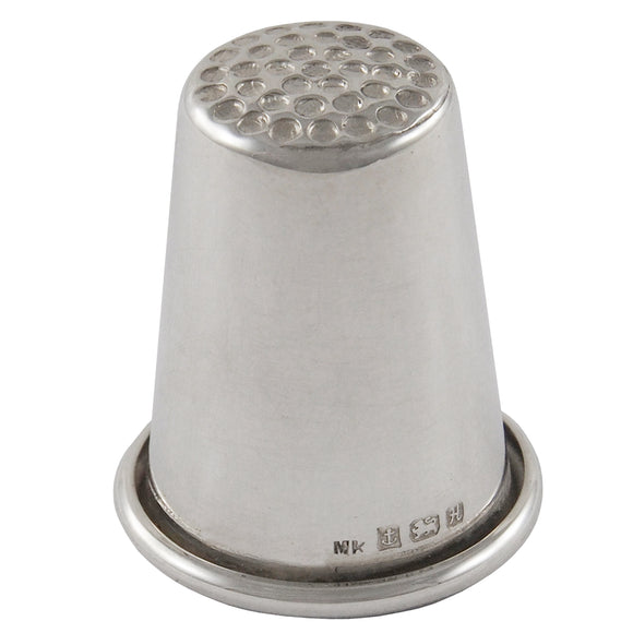 A modern, silver thimble.