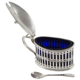 An early 20th century, silver mustard pot & spoon & blue glass liner.