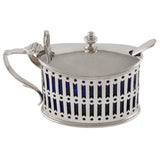 An early 20th century, silver mustard pot & spoon & blue glass liner.