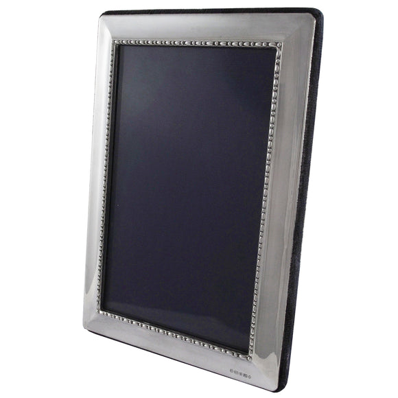 A modern, silver, rectangular photograph frame