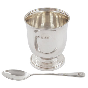 A mid-20th century, silver egg cup &amp; spoon.