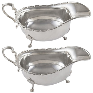 A pair of early 20th century, silver sauce boats.