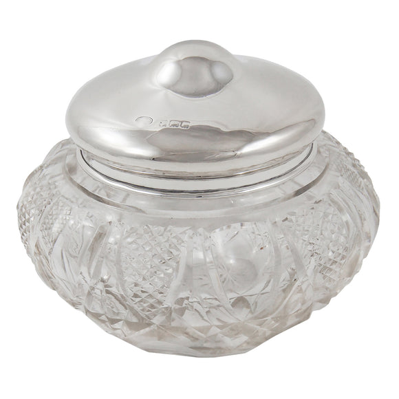 An Edwardian, large, cut glass jar with a silver lid