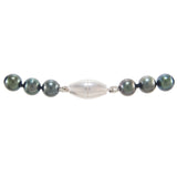 A modern, single row of black cultured pearls silver magnetic snap