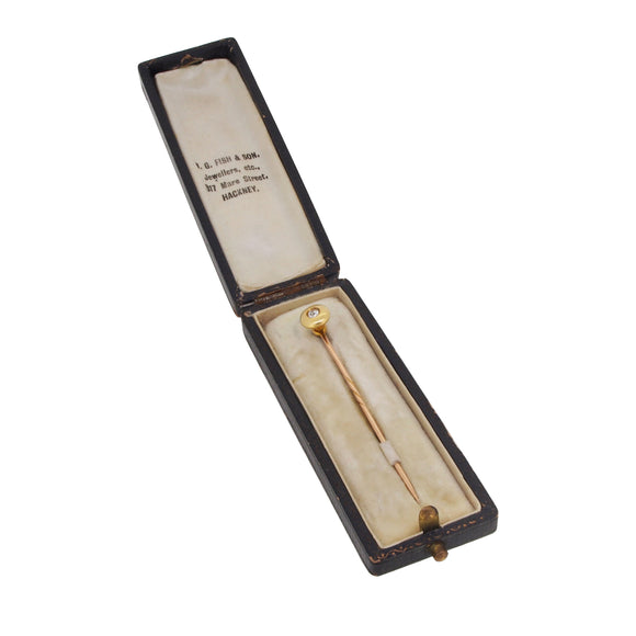 An early 20th century, yellow gold, diamond set stick pin & fitted case