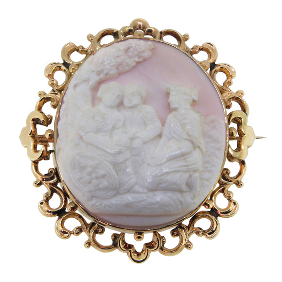A Victorian, yellow gold, ornate Cameo brooch, depicting three figures under a tree