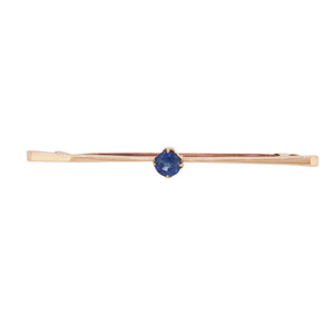 An early 20th century, 9ct yellow gold, sapphire set, single stone bar brooch