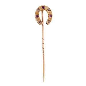A Victorian, yellow gold, ruby & rose diamond set, horseshoe stick pin