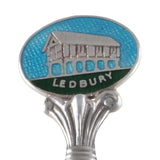 A mid-20th century, silver, enamel set souvenir teaspoon with the image of Ledbury Market Hall detail